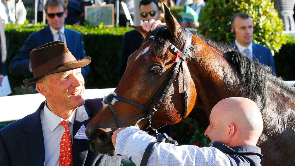 John Gosden gives Cracksman at pat after his thrilling victory in the Champion Stakes at Ascot
