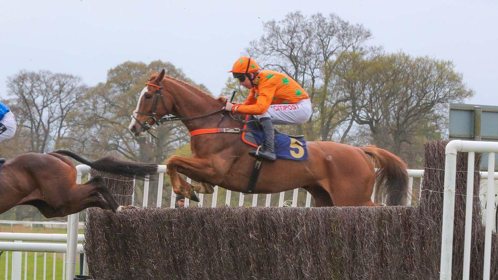 A fine jump by Double W's on his way to an emotional win in the 2m handicap chase