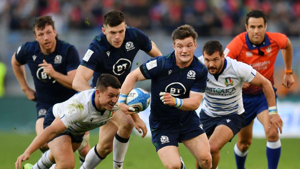 Italy players try in vein to catch Scotland's George Horne