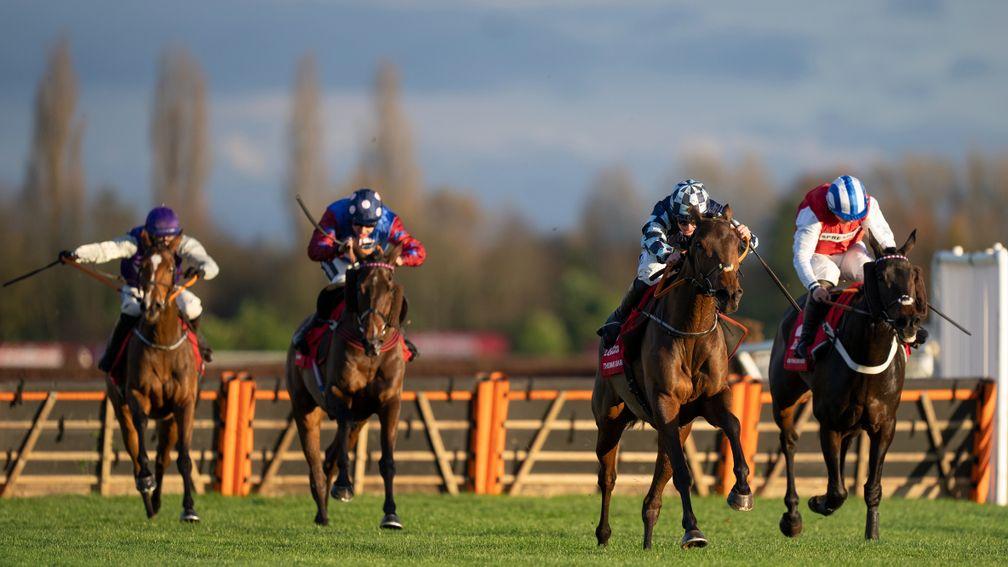 Thomas Darby (second right) on his way to winning the Long Distance Hurdle at Newbury