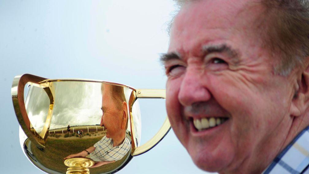 Dermot Weld is pictured with the trophy for the Melbourne Cup, the race he famously conquered 30 years ago