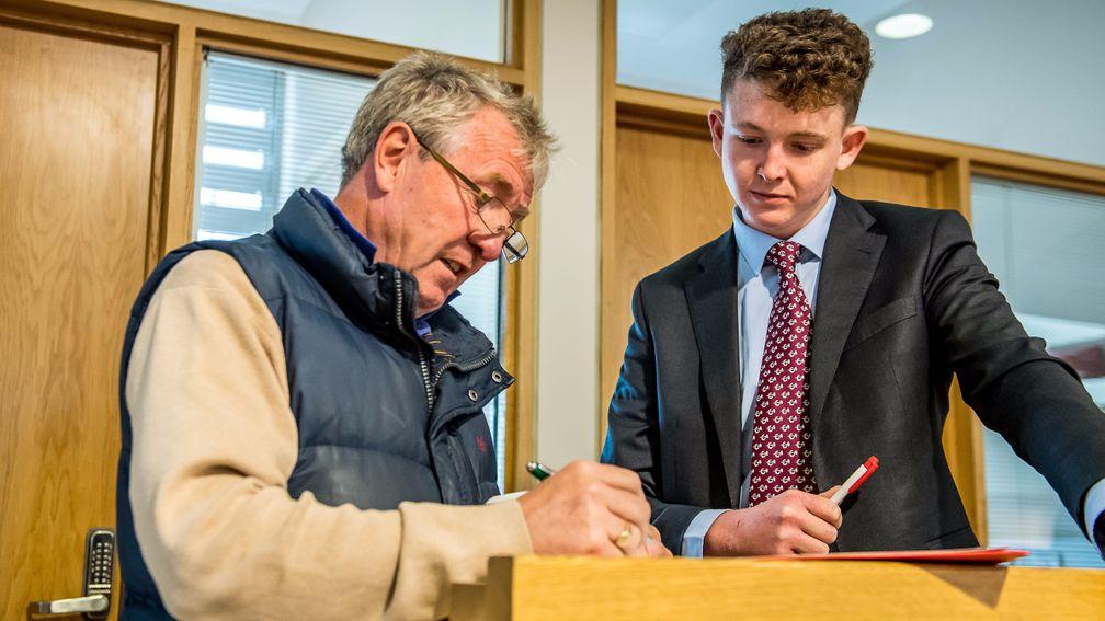 Bryan Smart signs a docket at last year's Goffs UK Silver Yearling Sale