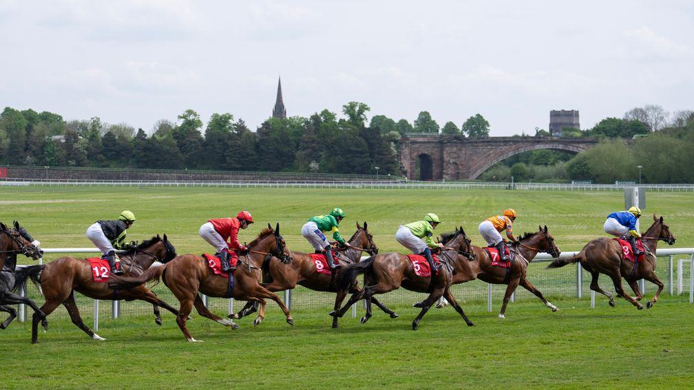 Percy's Lad leads the runners in the 7½f handicap towards the Grosvenor Bridge bend