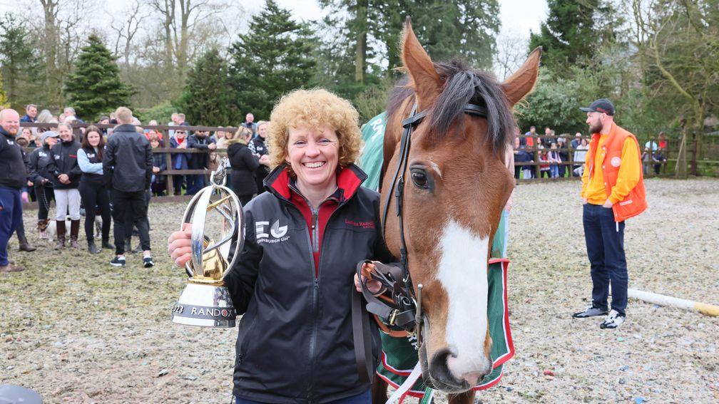 Lucinda Russell with Corach Rambler and her Grand National trophy