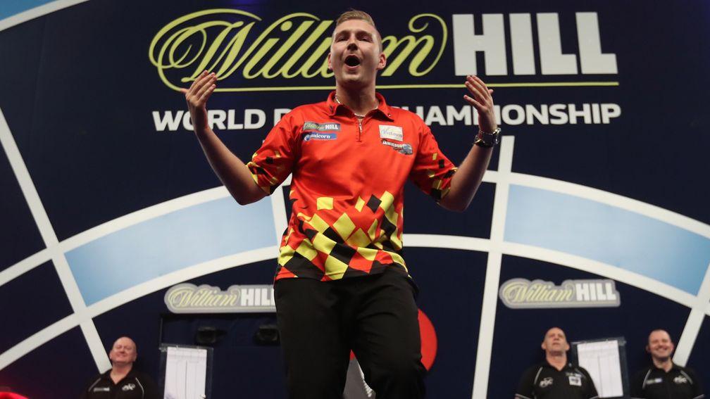 Dimitri van den Bergh encourages the crowd at the World Championship