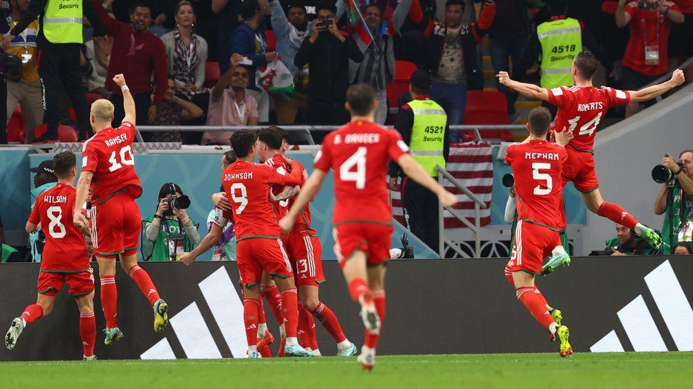 Wales celebrate Gareth Bale's penalty equaliser against the USA on Monday