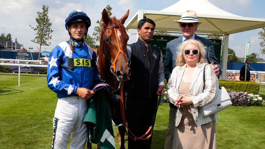 Heroic's owners Christopher and Jenny Powell with Ginger Nut, Harry Bentley and groom Babu Singh after victory in the Weatherbys Super Sprint at Newbury
