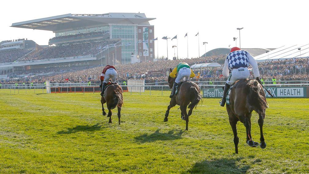 Tiger Roll leads Magic Of Light and Rathvinden in the Grand National at Aintree