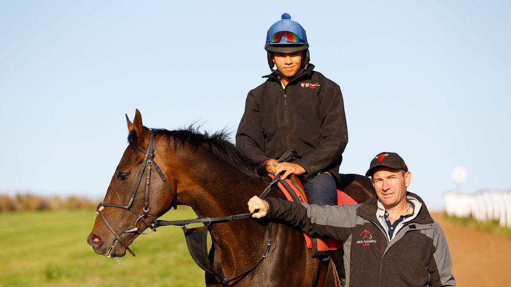 Jonathan Clayton (on horseback) pictured with his husband, trainer Mick Appleby