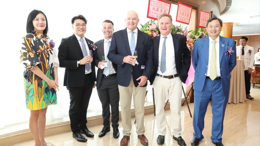 The HKTBA members with, from third left, trainers Jamie Richards and David Hayes and Swettenham Stud's Adam Sangster