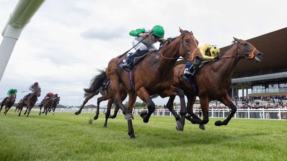 Rosallion and Sean Levey (right) fend of Haatem for the Irish 2,000 Guineas at the Curragh