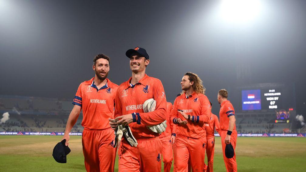 Scott Edwards leads the Netherlands off after their win over Bangladesh
