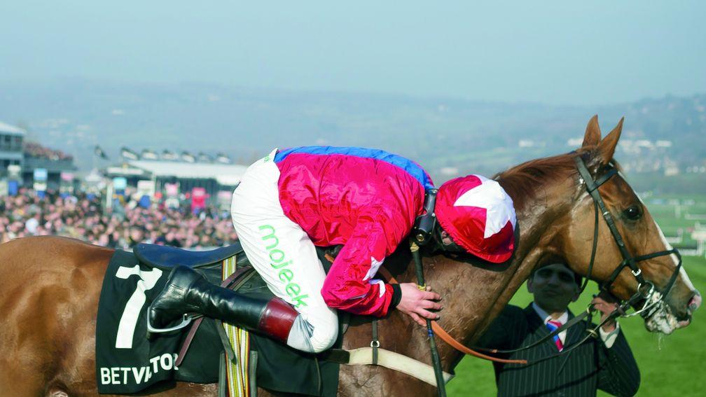 Jamie Moore hugs Sire De Grugy affectionately as the pair win the Queen Mother Champion Chase Cheltenham Festival Day 2 Photo: Patrick McCann 12.03.2014