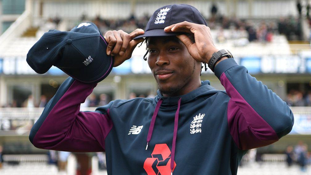 Fast bowler Jofra Archer tries on his England Test cap at Lord's