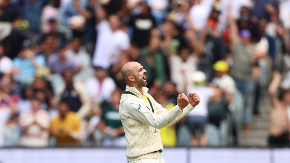 Nathan Lyon celebrates one of his three wickets on day one of the Boxing Day Test