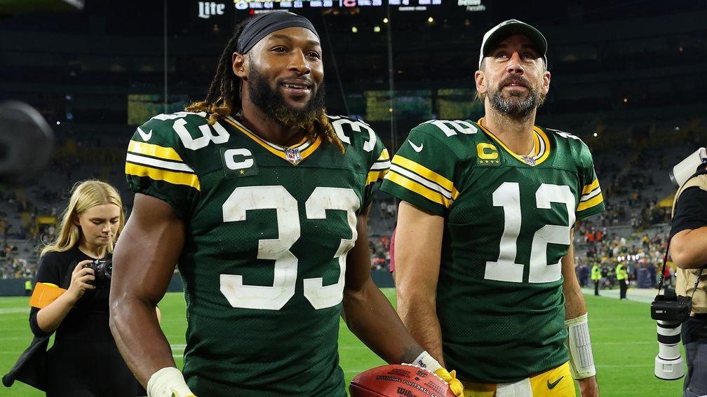 Aaron Jones (L) and Aaron Rodgers were key to the Packers crushing the Bears on Monday