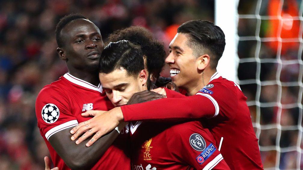 Philippe Coutinho celebrates with Liverpool mates Mohamed Salah, Roberto Firmino and Sadio Mane