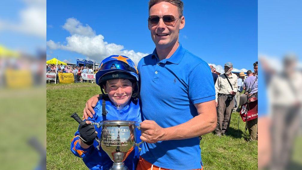 Tubs McNally and his father Ronan celebrate the 12-year-old's champion jockey title win at Dingle last weekend