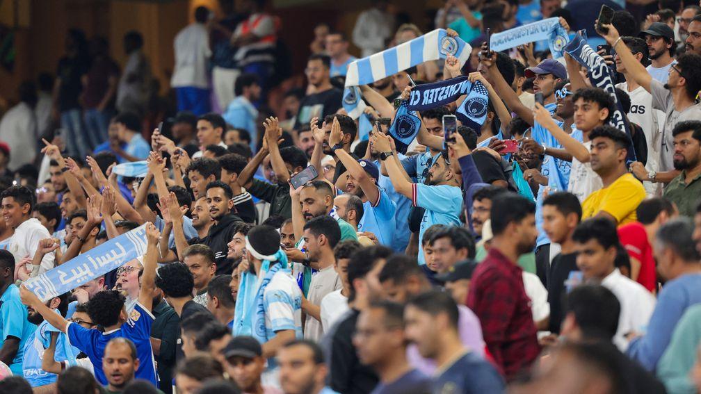 Manchester City's fans cheer their team at the Club World Cup