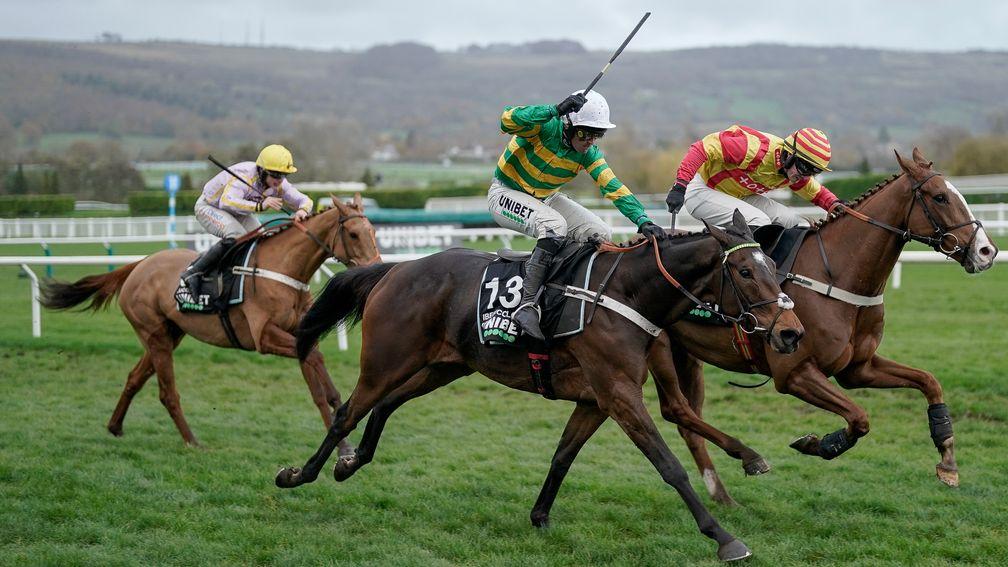 Iberico Lord and Nico de Boinville (green) win the Greatwood Handicap Hurdle at Cheltenham from Lookaway and Luccia