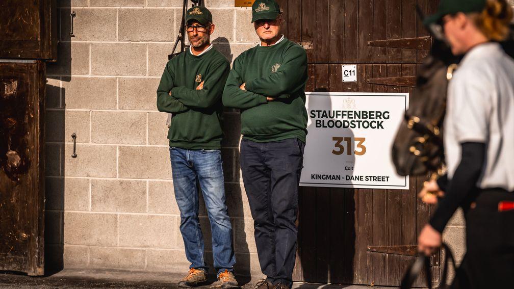Philipp Stauffenberg (right) surveys the scene as one of his team's yearlings is led up at the Goffs sales complex