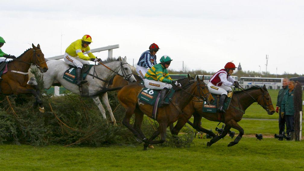 Neptune Collonges (grey horse) on his way to winning the 2012 Grand National, the last directed for television by Steve Docherty
