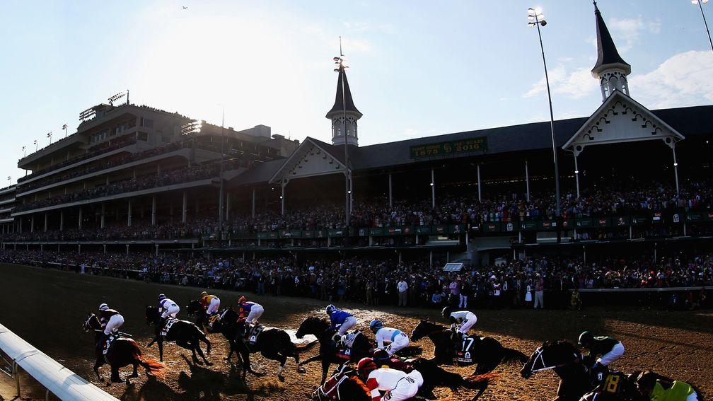 The field for the Kentucky Derby passes the twin towers at Churchill Downs