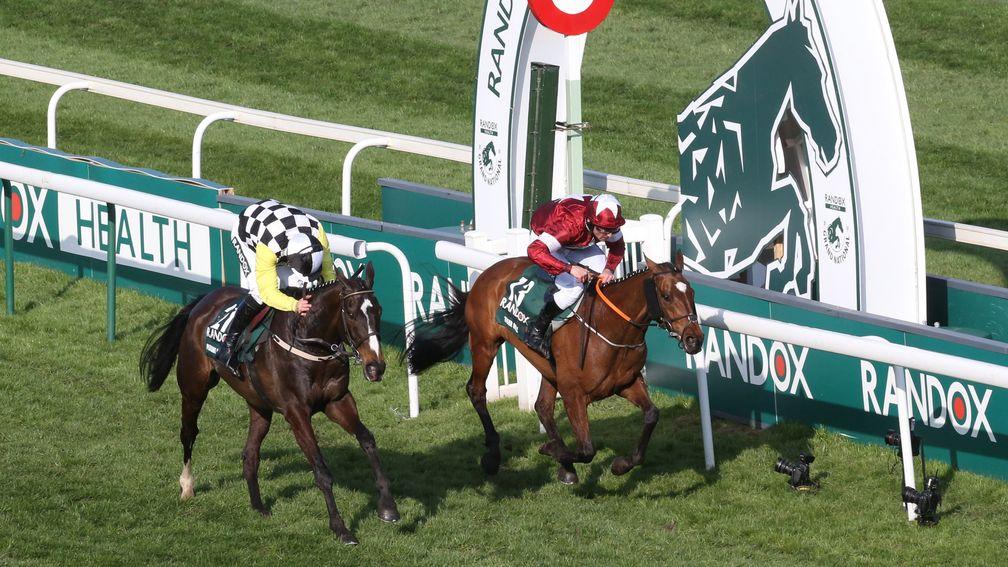 Pleasant Company (left) just fails to reel in Tiger Roll in last year's Grand National