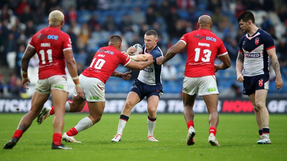 England's Harry Newman takes on the Tonga line in the Second Test at Huddersfield