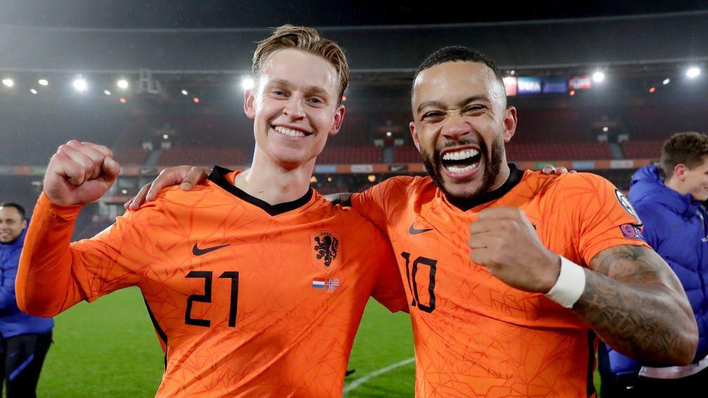 Frenkie de Jong (left) and Memphis Depay celebrate the Netherlands' qualification
