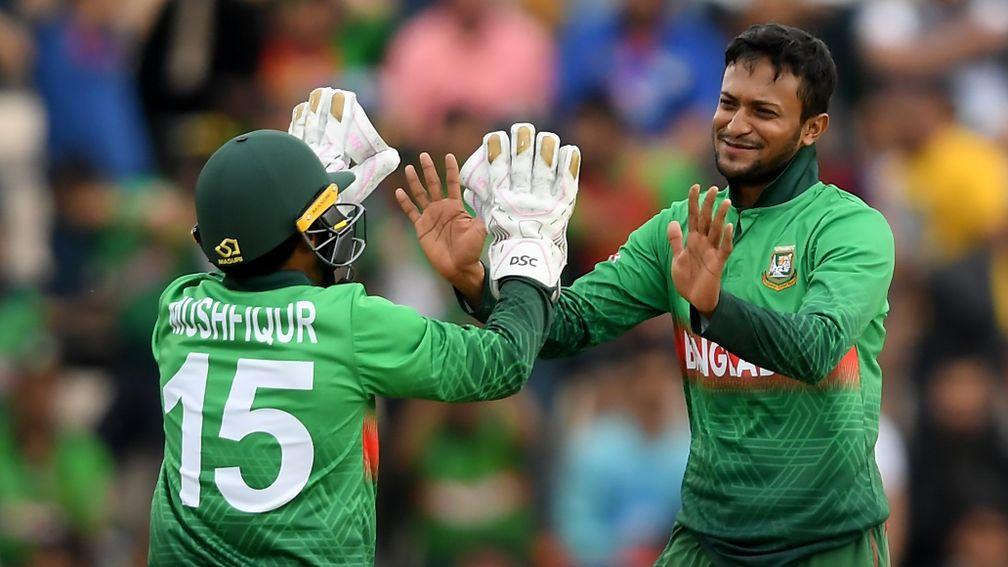 Shakib Al Hasan (right) celebrates one of his five wickets against Afghanistan