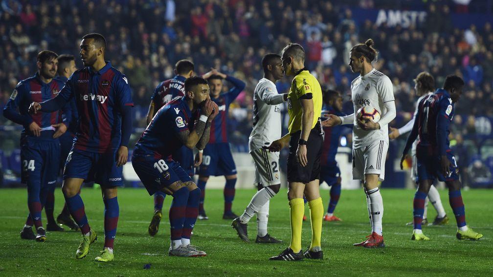 Levante players protest to the referee after Real Madrid were awarded a penalty on Sunday