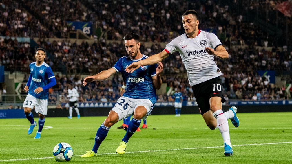 Adrien Thomasson of RC Strasbourg (right) in action against Frankfurt in the Europa League