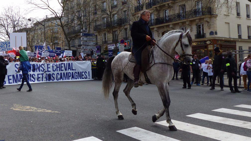 Top equestrian display rider Mario Luraschi leads the march in Paris on Wednesday
