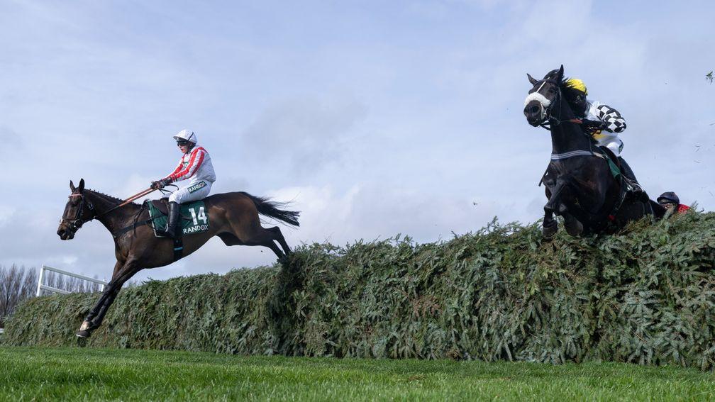 Latenightpass (Gina Andrews,left) jumps the 2nd last fence to win the Foxhunters ChaseAintree 7.4.22 Pic: Edward Whitaker