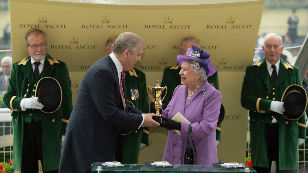 The Queen receives the Gold Cup from her son the Duke Of York after Estimate's victory in 2013