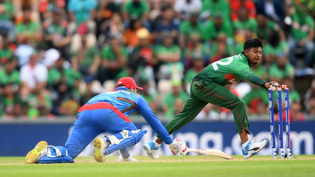 Mosaddek Hossain of Bangladesh attempts a run-out during the win over Afghanistan