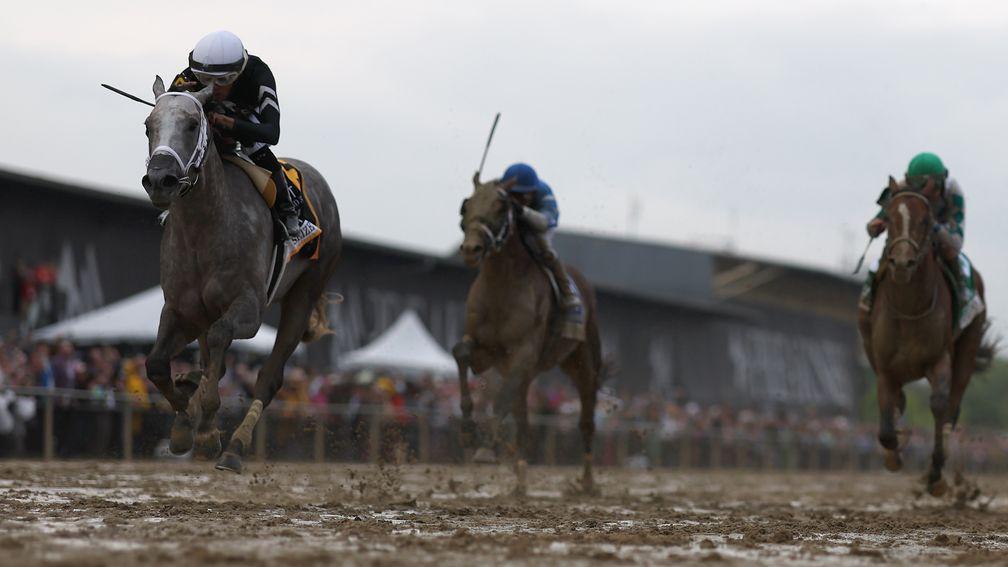 Seize The Grey pulls clear of Mystick Dan (right) and Catching Freedom to win the Preakness Stakes