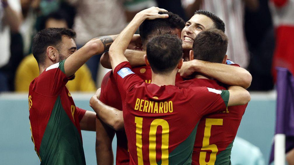 Portugal celebrate their 6-1 last-16 victory over Switzerland