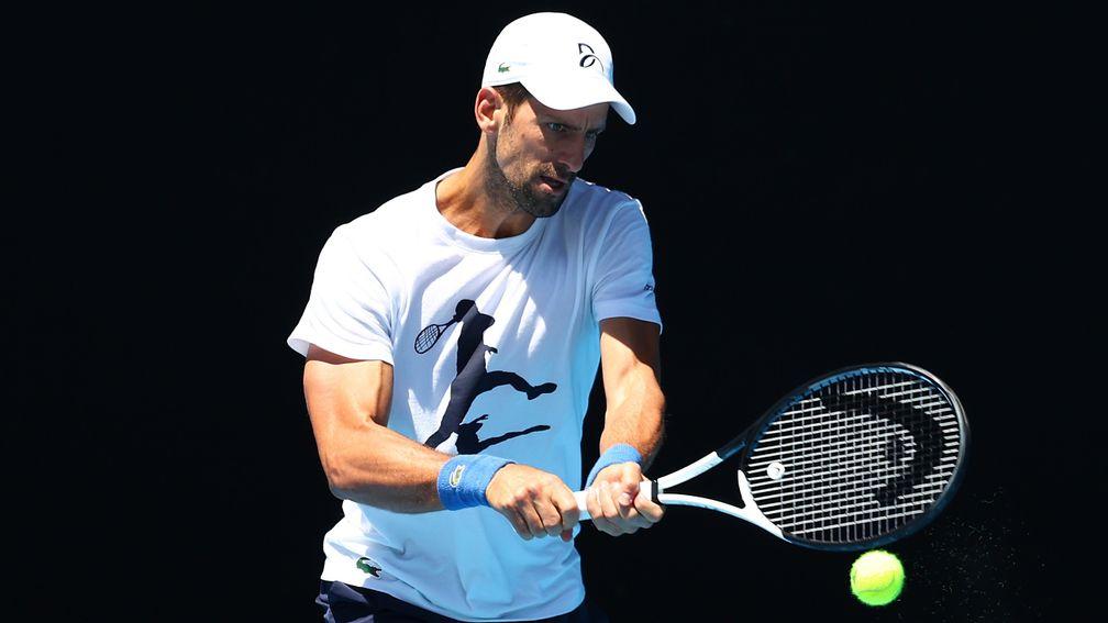 Muscle-bound Novak Djokovic looks fit as a fiddle in training for this year's Australian Open