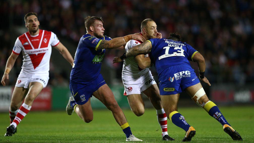 Saints' James Roby takes on the  Warrington Wolves defence in last year's Betfred Super League semi-finals