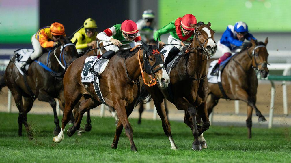 Facteur Cheval (second right) holds off Namur in the Dubai Turf