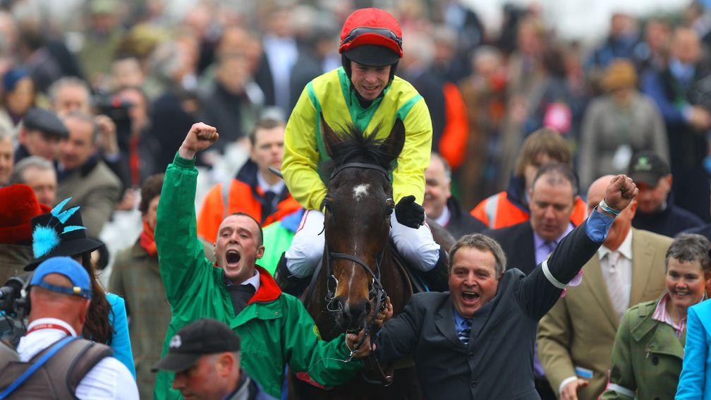 Cheltenham cheer: Andrew Lynch and Sizing Europe return to a great reception after winning the 2011 Queen Mother Champion Chase
