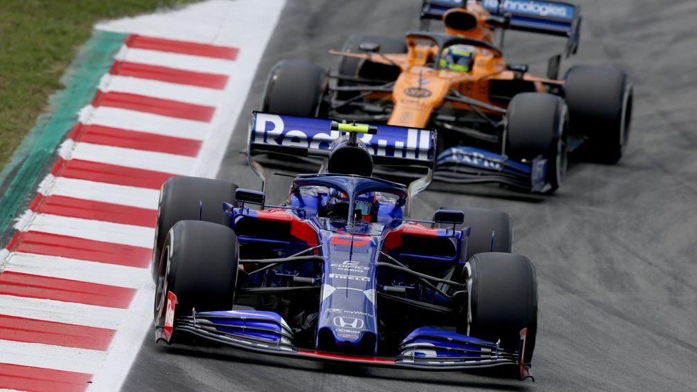Alex Albon chased by Lando Norris at Barcelona