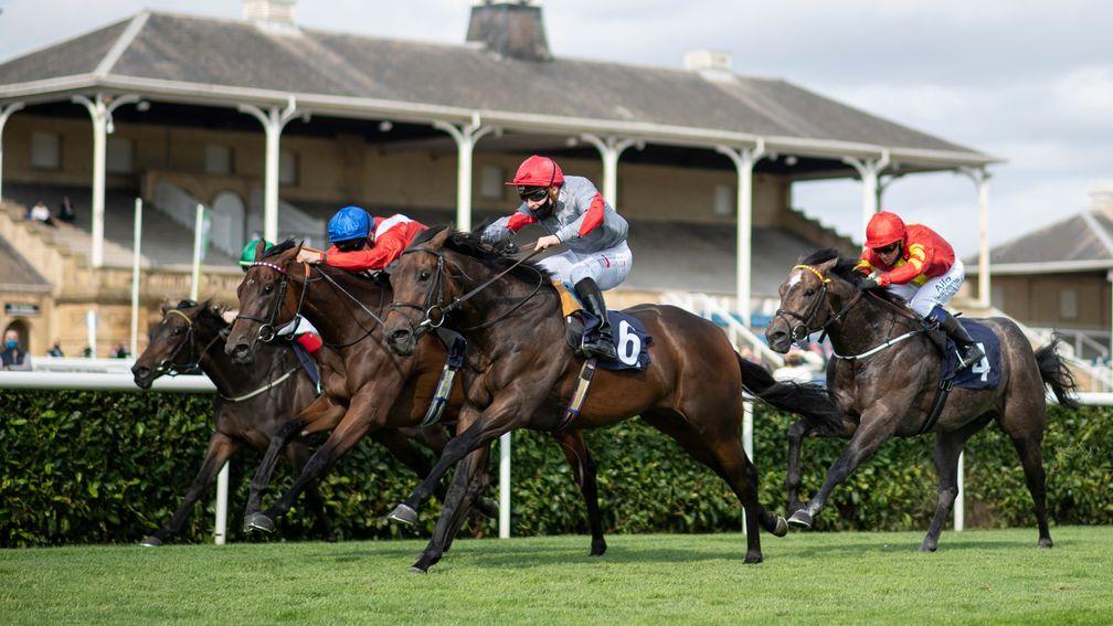 Ubettabelieveit (near) wins the Bombardier Flying Childers Stakes from Sacred (blue cap)