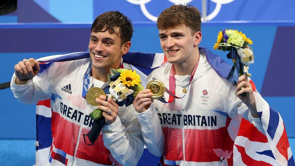 Tom Daley (left) and Matty Lee are all smiles after winning gold men's synchronised 10m platform event