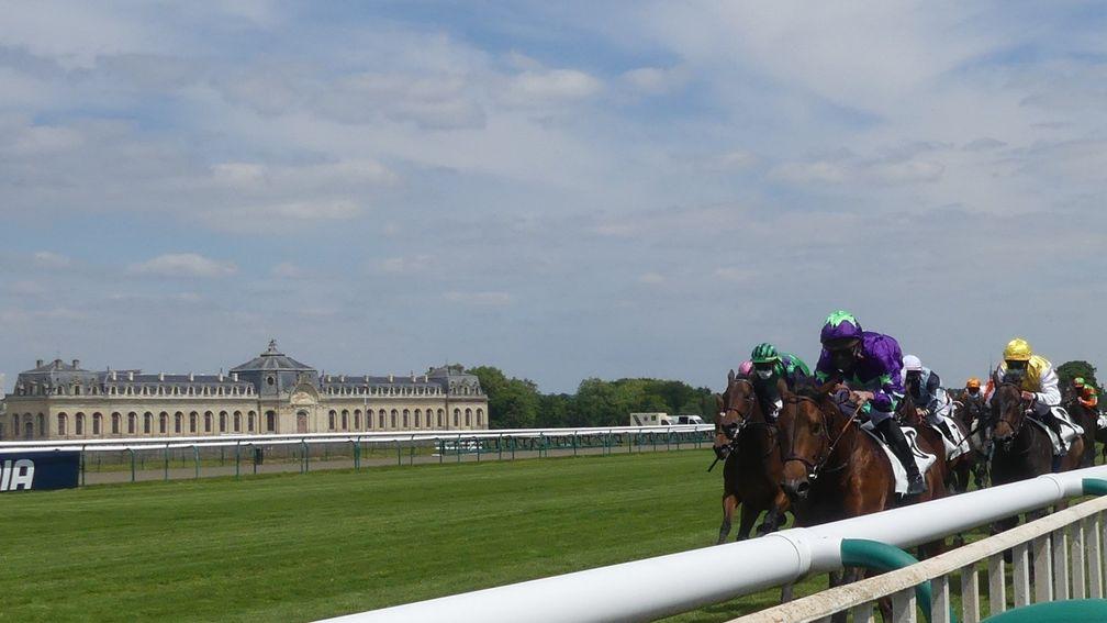 Hurricane Ivor leads the runners up the Chantilly straight, with the magnificent Grandes Ecuries in the background