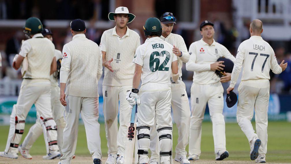 England fielders and the not out Australian batsmen shake hands when the Lord's Test ended as a draw