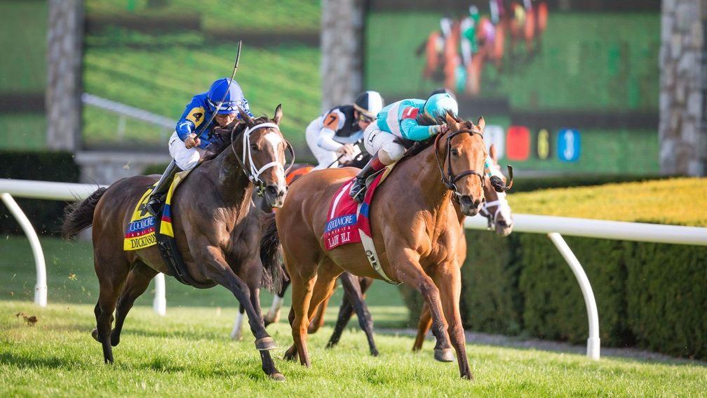 Dickinson (left) grinds down Lady Eli to win at Keeneland on Saturday