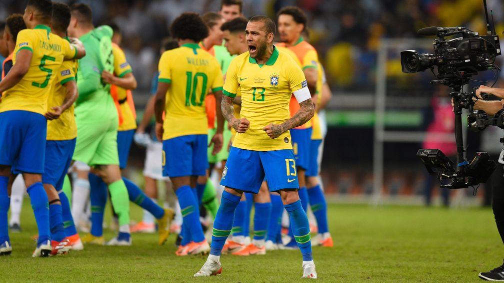 Dani Alves celebrates Brazil winning their Copa America semi-final against Argentina in Belo Horizonte